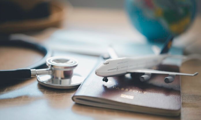 Medical tourism in Coimbatore with passport and stethoscope